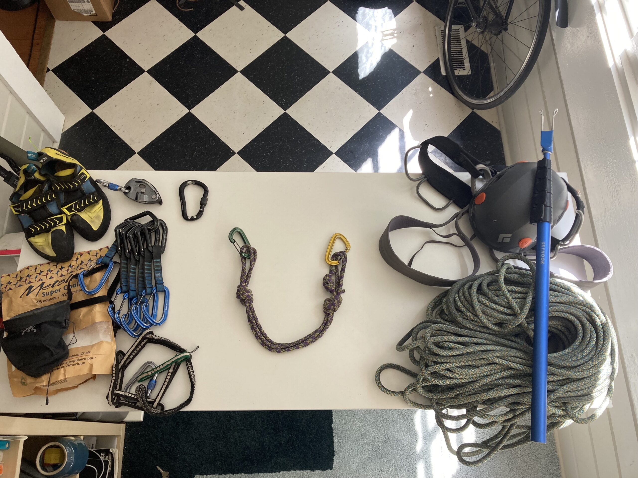 rock climbing anchor surrounded by gear