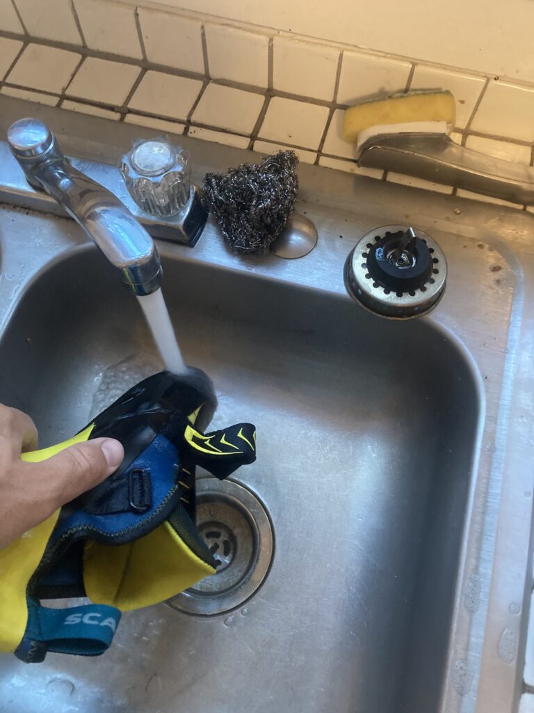 Last step to clean a climbing shoe: rinse it