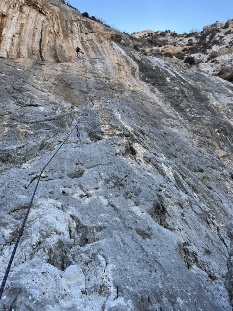 Rock climbing wall in Kalymnos with climber 